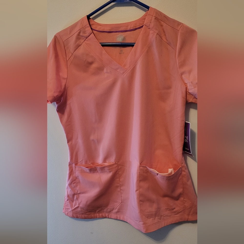 New with tags,size XS Healing hands scrubs, melon color. Jogger style.
